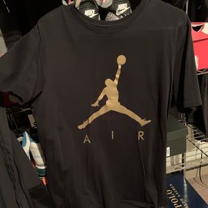Jordan tee shirt. Black and gold